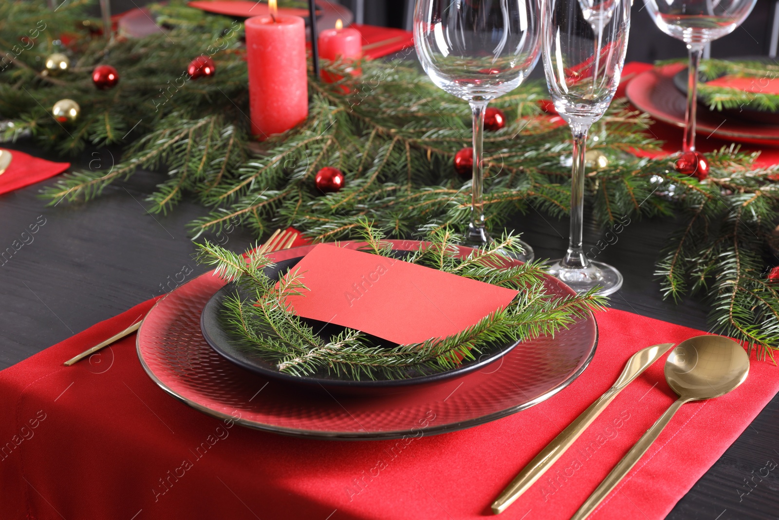 Photo of Elegant Christmas table setting with blank place card and festive decor