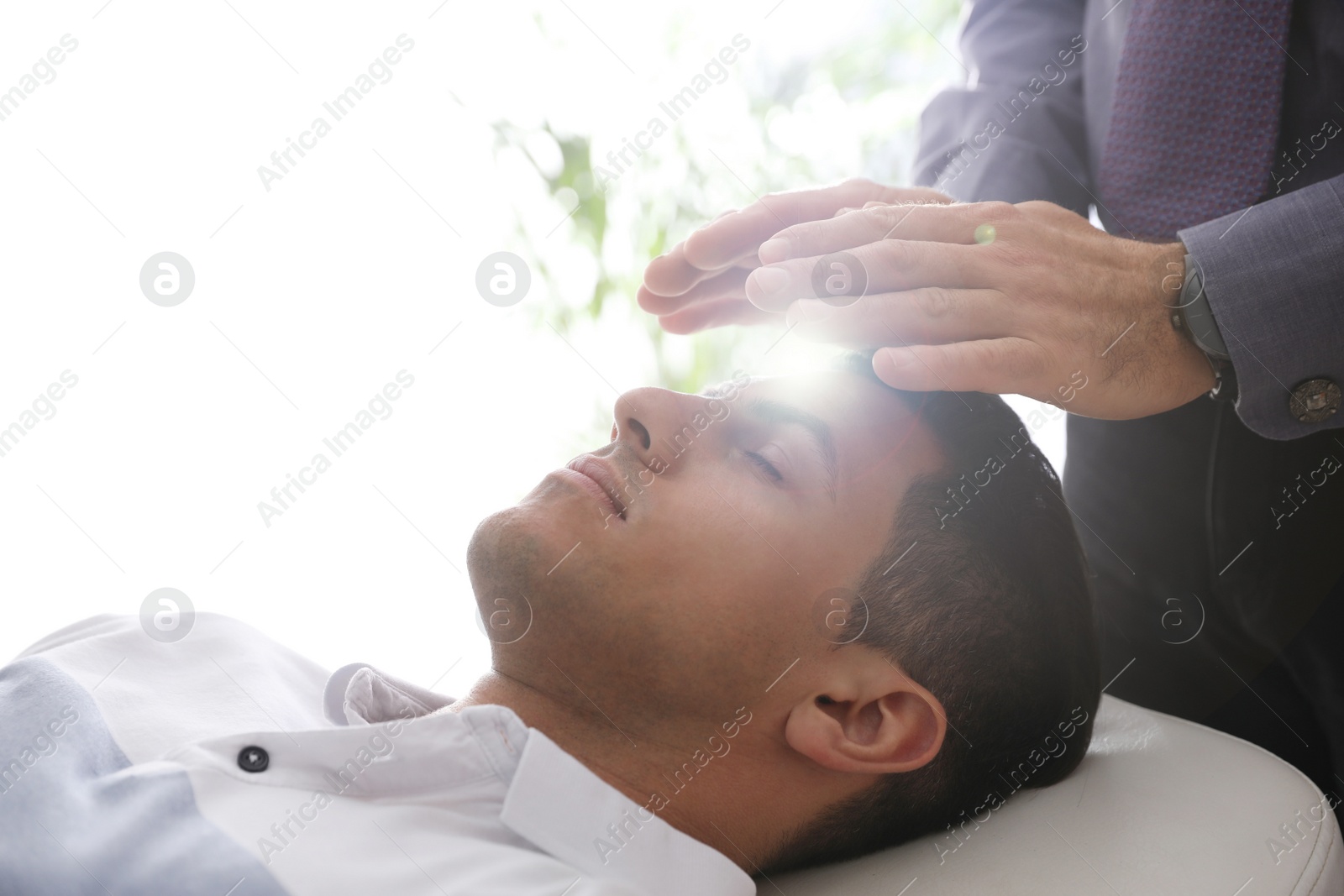 Photo of Psychotherapist and patient in office. Hypnotherapy session