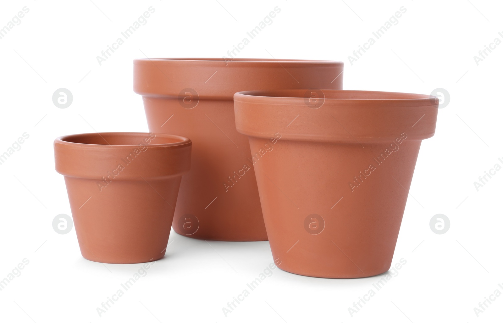 Photo of Stylish terracotta flower pots isolated on white