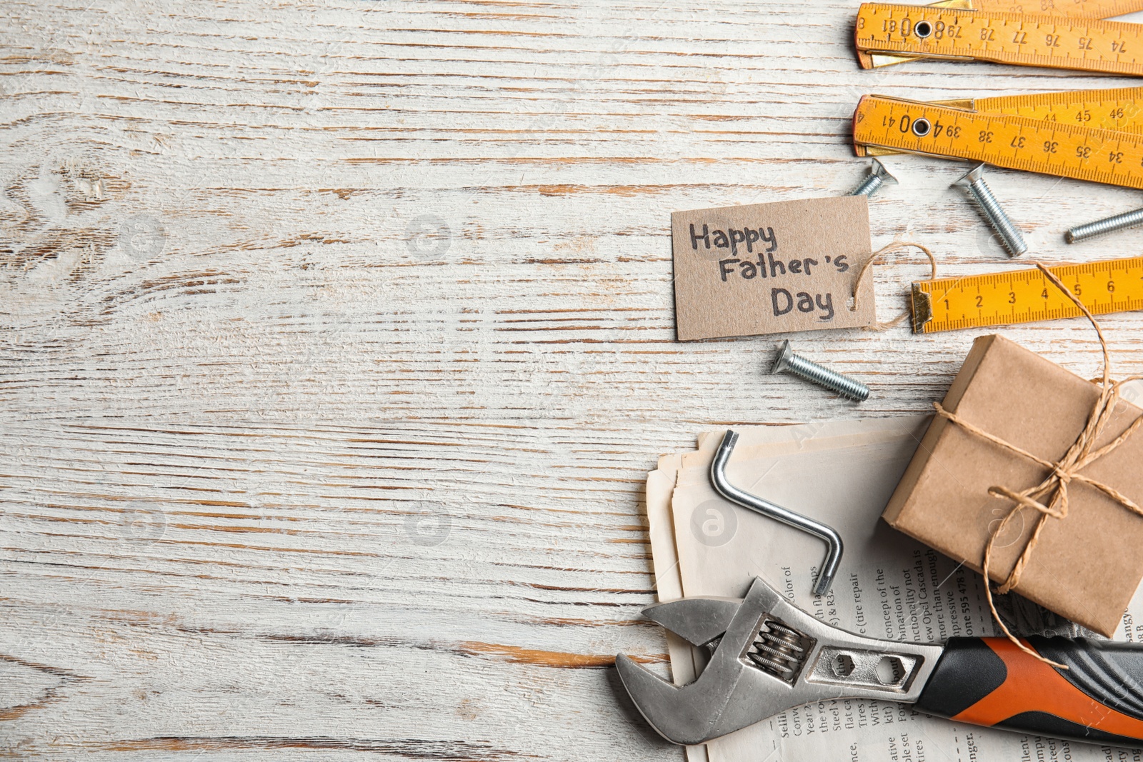 Photo of Flat lay composition with different tools on white wooden background, space for text. Happy Father's Day