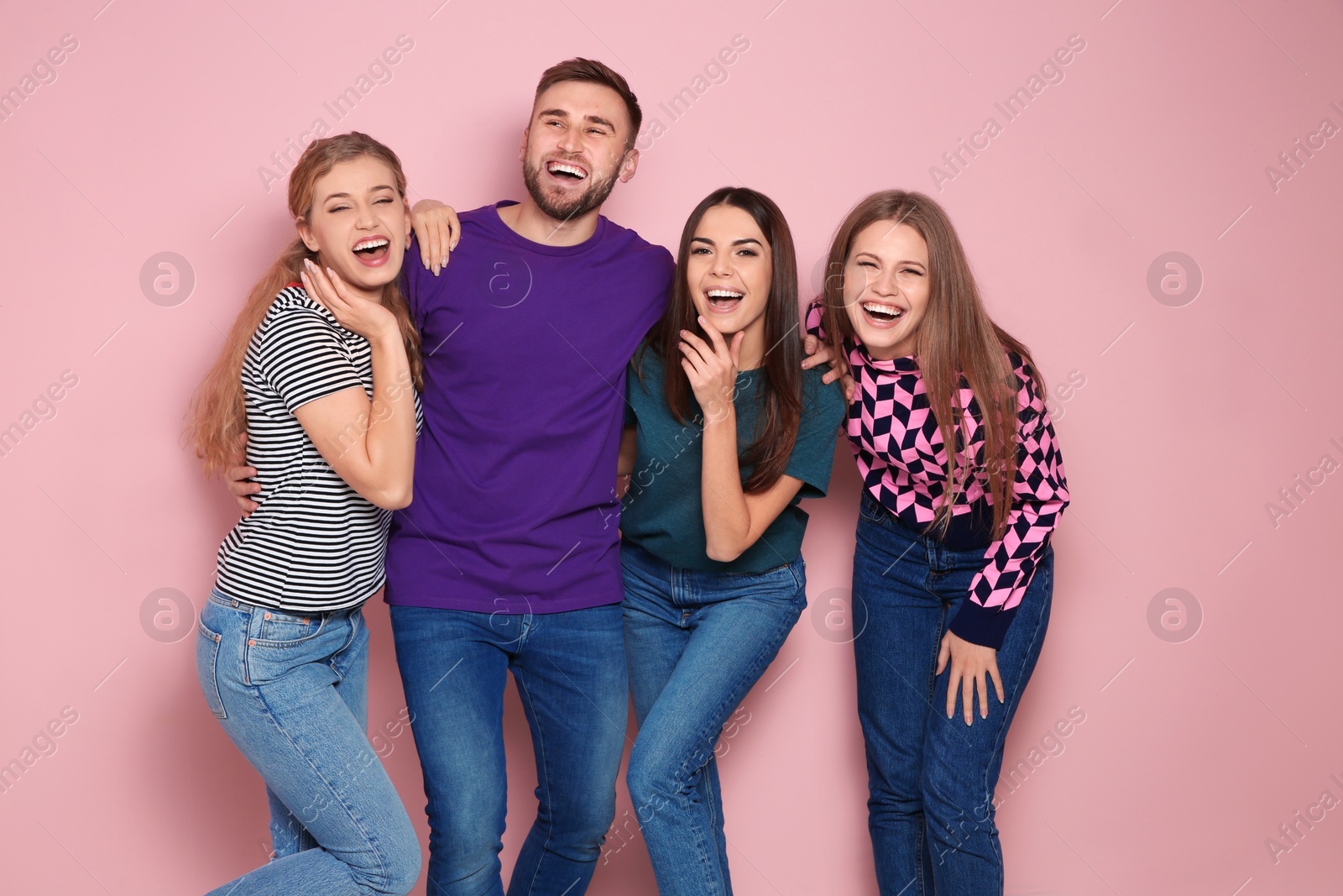 Photo of Portrait of young people laughing on color background