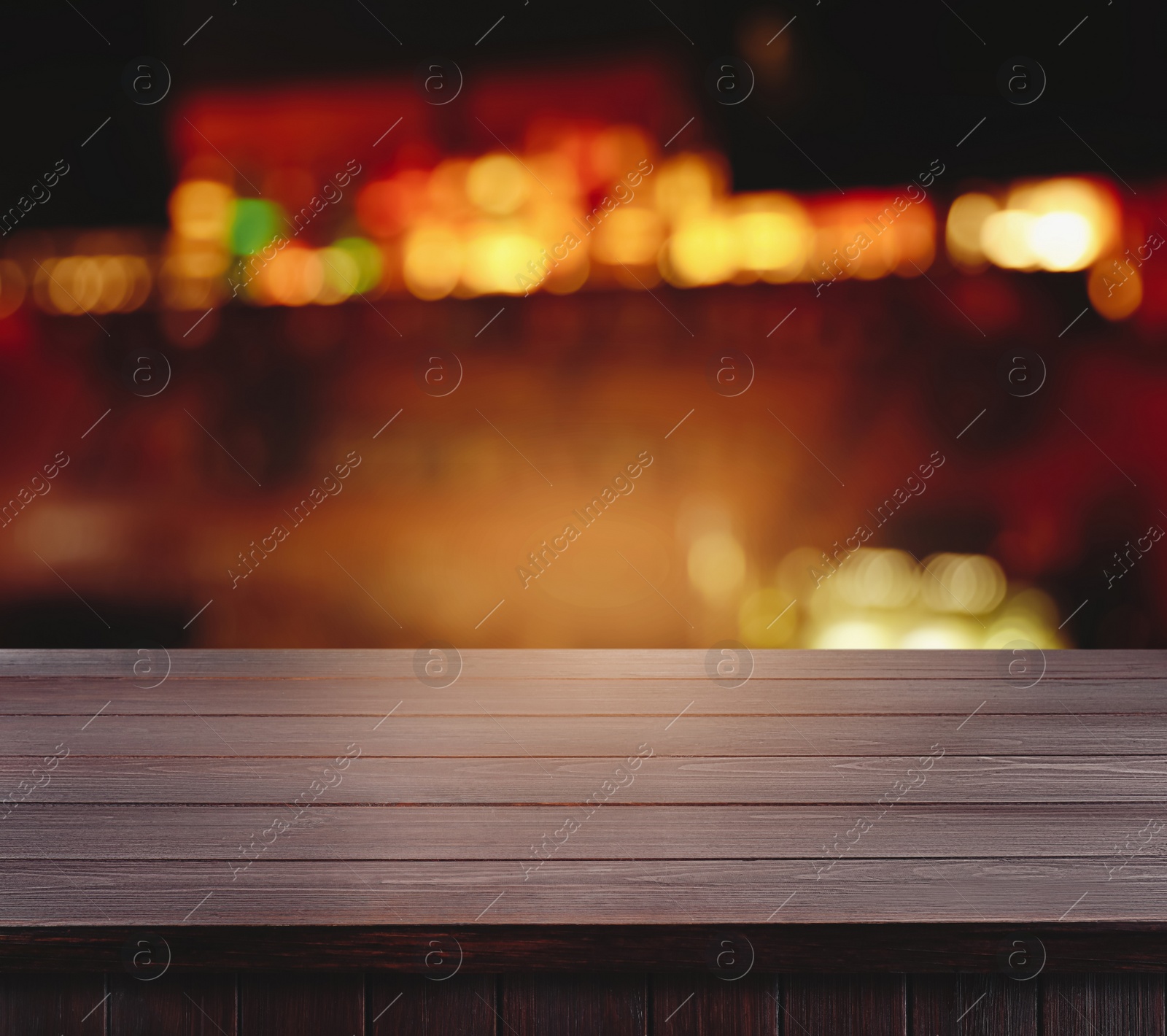 Image of Empty wooden surface and blurred view of bar interior. Space for design