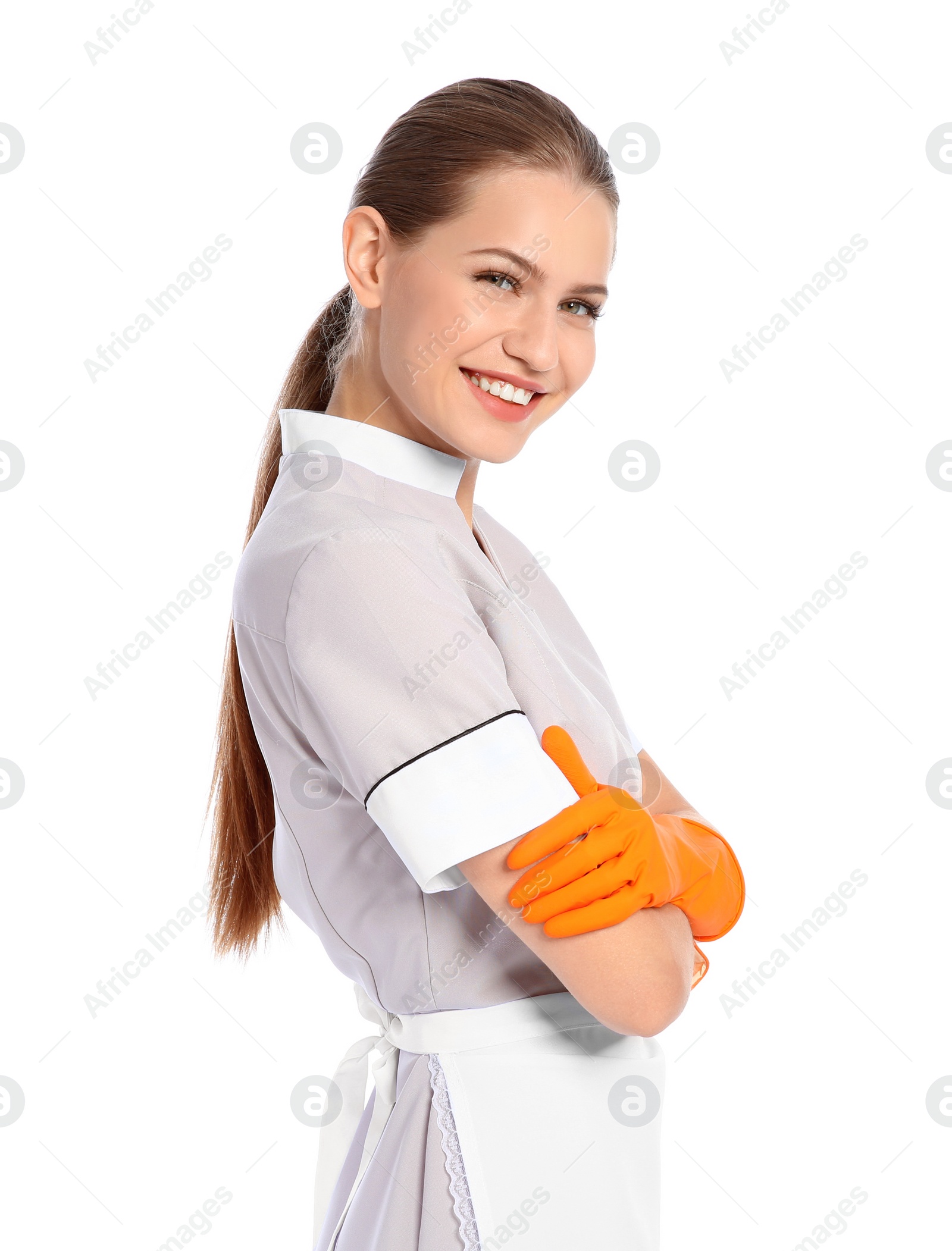 Photo of Portrait of young chambermaid in tidy uniform on white background