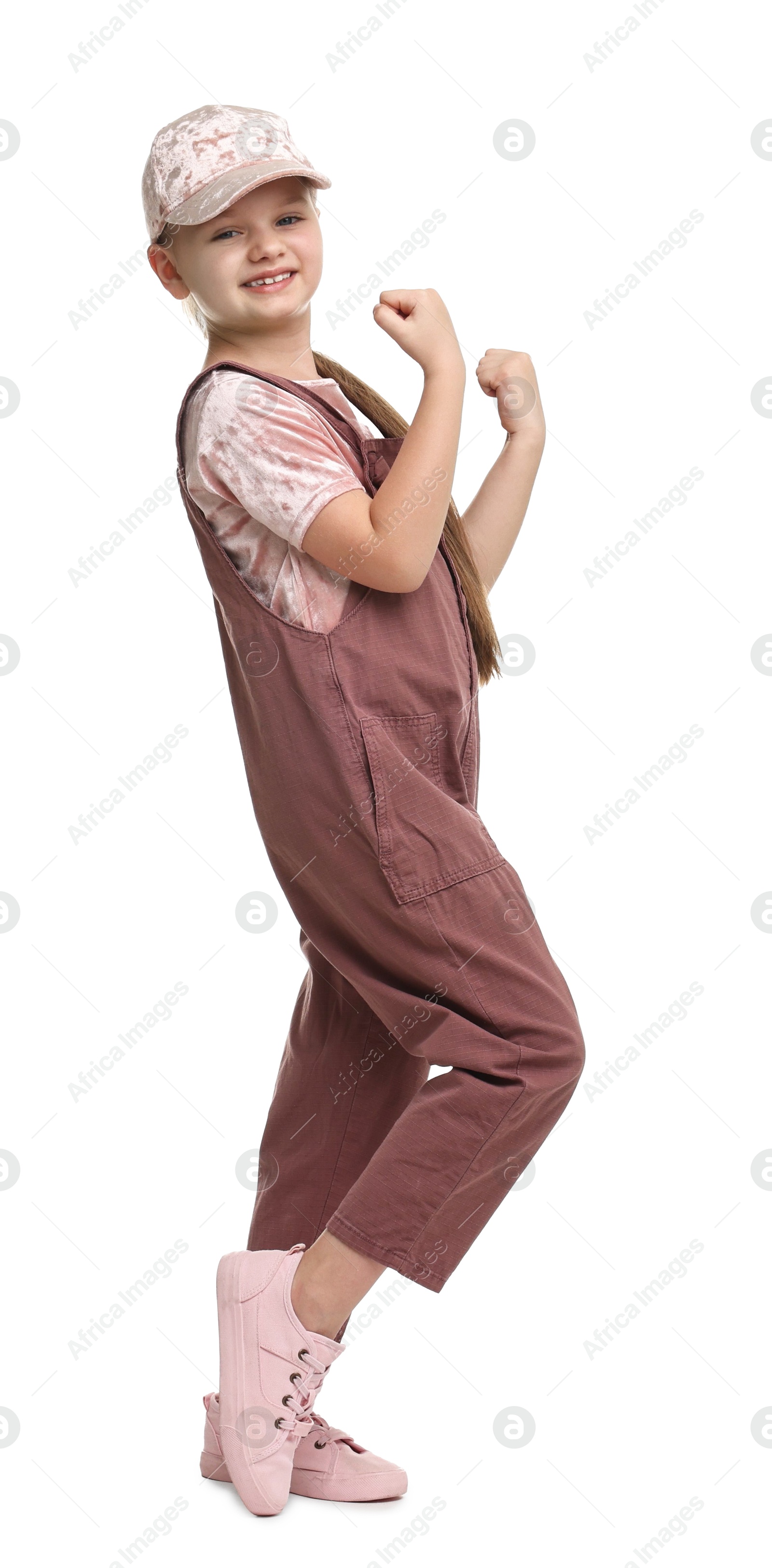 Photo of Cute little girl dancing on white background