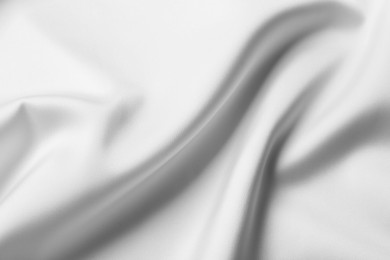 Texture of white silk ripple fabric as background, closeup