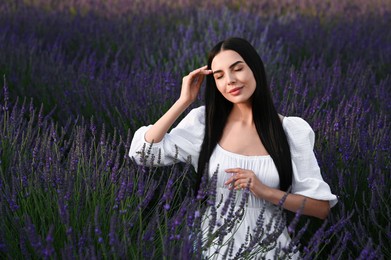 Portrait of beautiful young woman in lavender field
