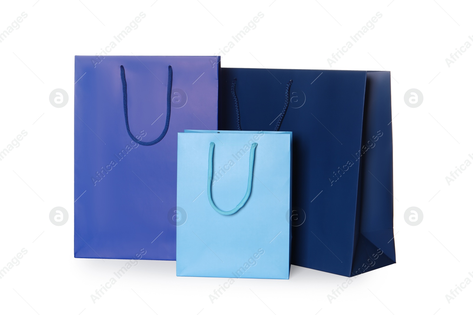 Photo of Blue paper shopping bags isolated on white