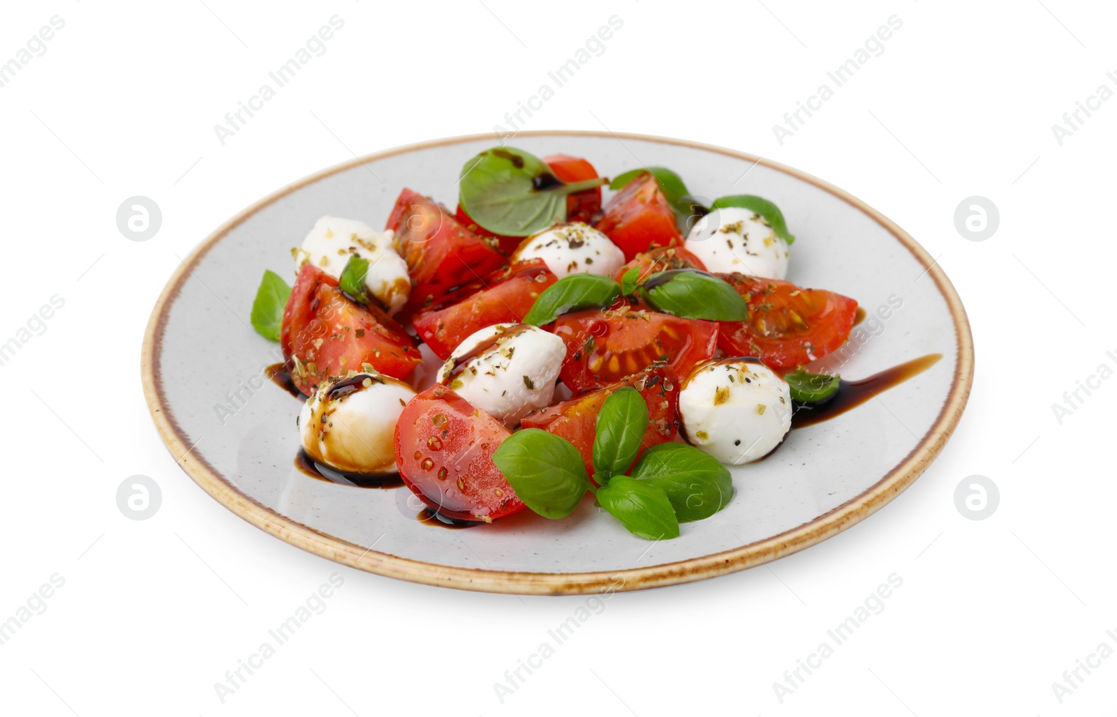 Photo of Tasty salad Caprese with mozarella balls, tomatoes, basil and sauce on white background