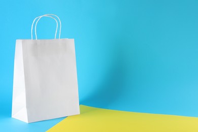 One paper bag on color background, space for text