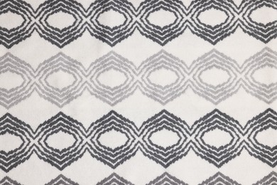 Photo of Soft bath mat with pattern as background, top view