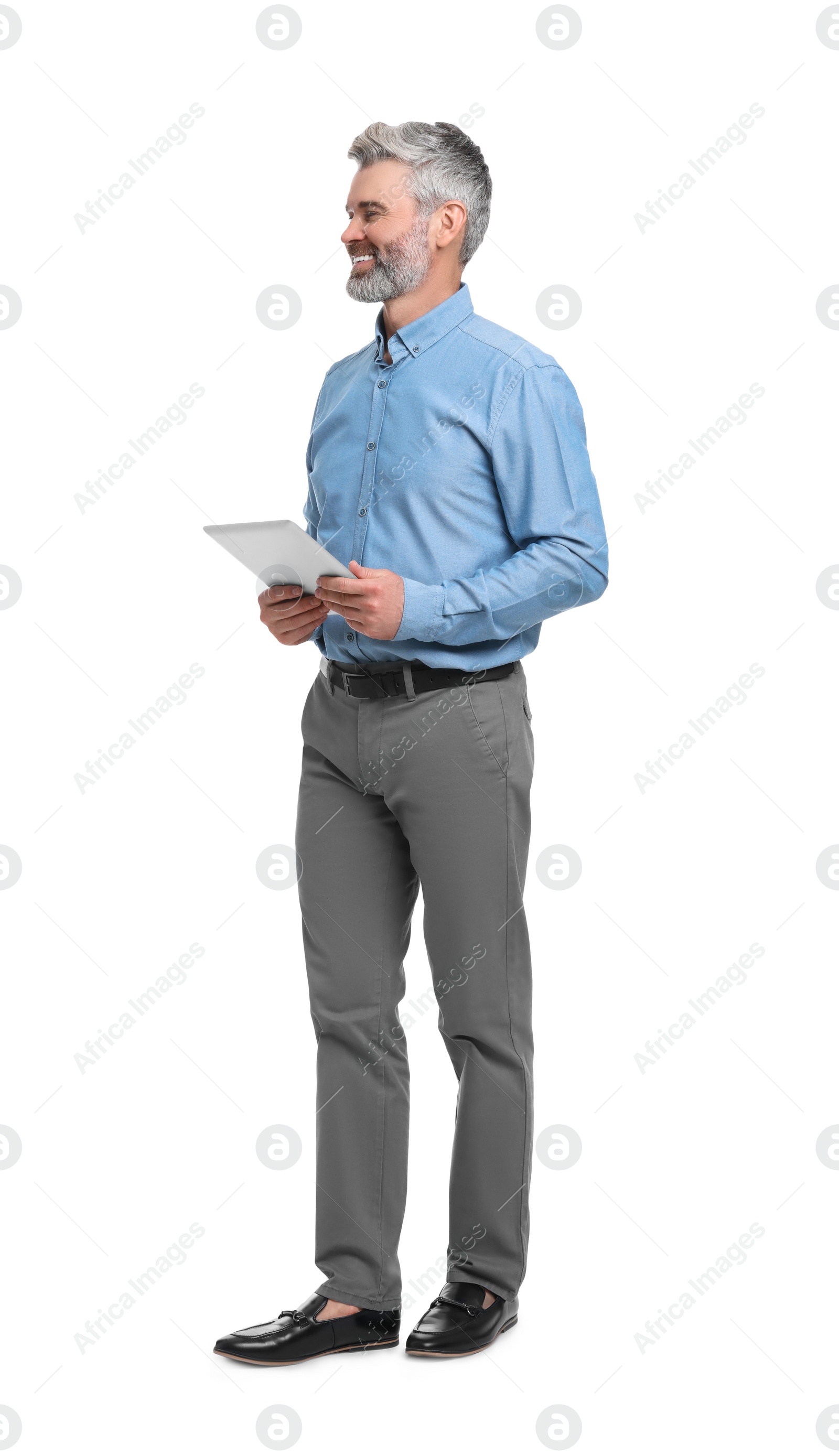 Photo of Mature businessman in stylish clothes with tablet on white background