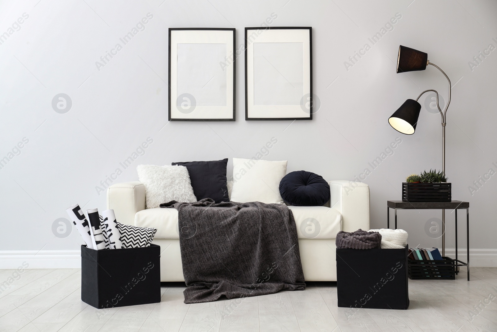 Photo of Elegant white sofa in modern living room interior