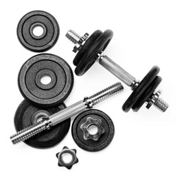 Photo of Metal dumbbell and parts on white background, top view. Sports equipment