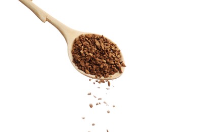 Photo of Pouring instant coffee from wooden spoon on white background