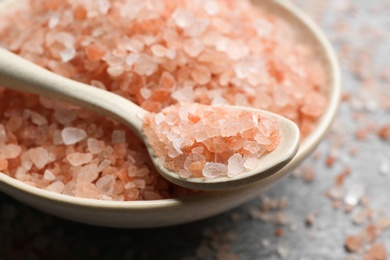 Photo of Spoon and bowl with pink himalayan salt, closeup