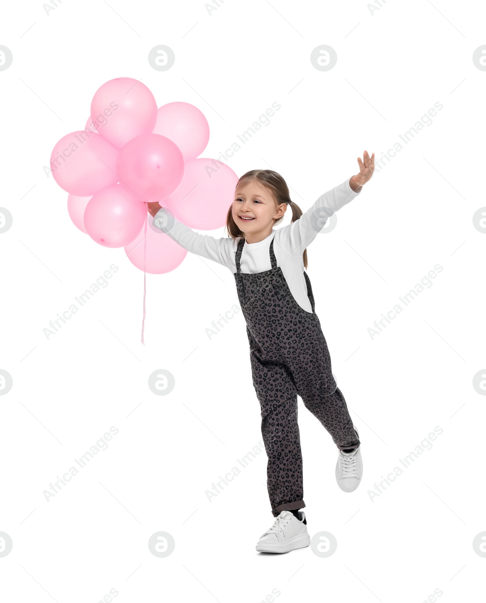 Photo of Cute girl with pink balloons on white background