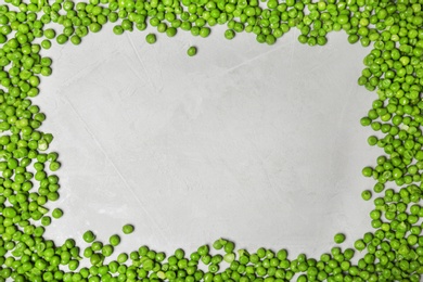 Photo of Flat lay composition with frozen peas on grey background. Vegetable preservation