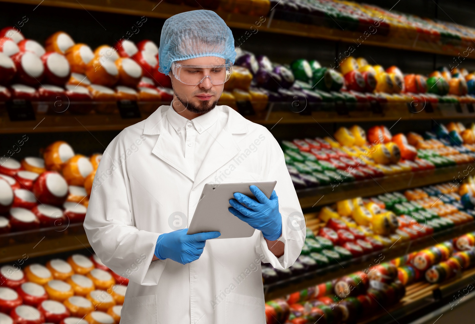 Image of Food quality control specialist examining products in supermarket