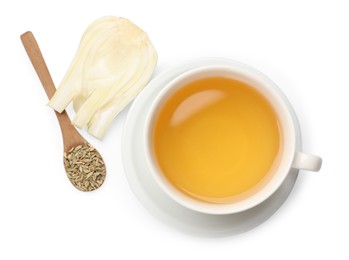 Photo of Aromatic fennel tea in cup, seeds, fresh vegetable and spoon isolated on white, top view