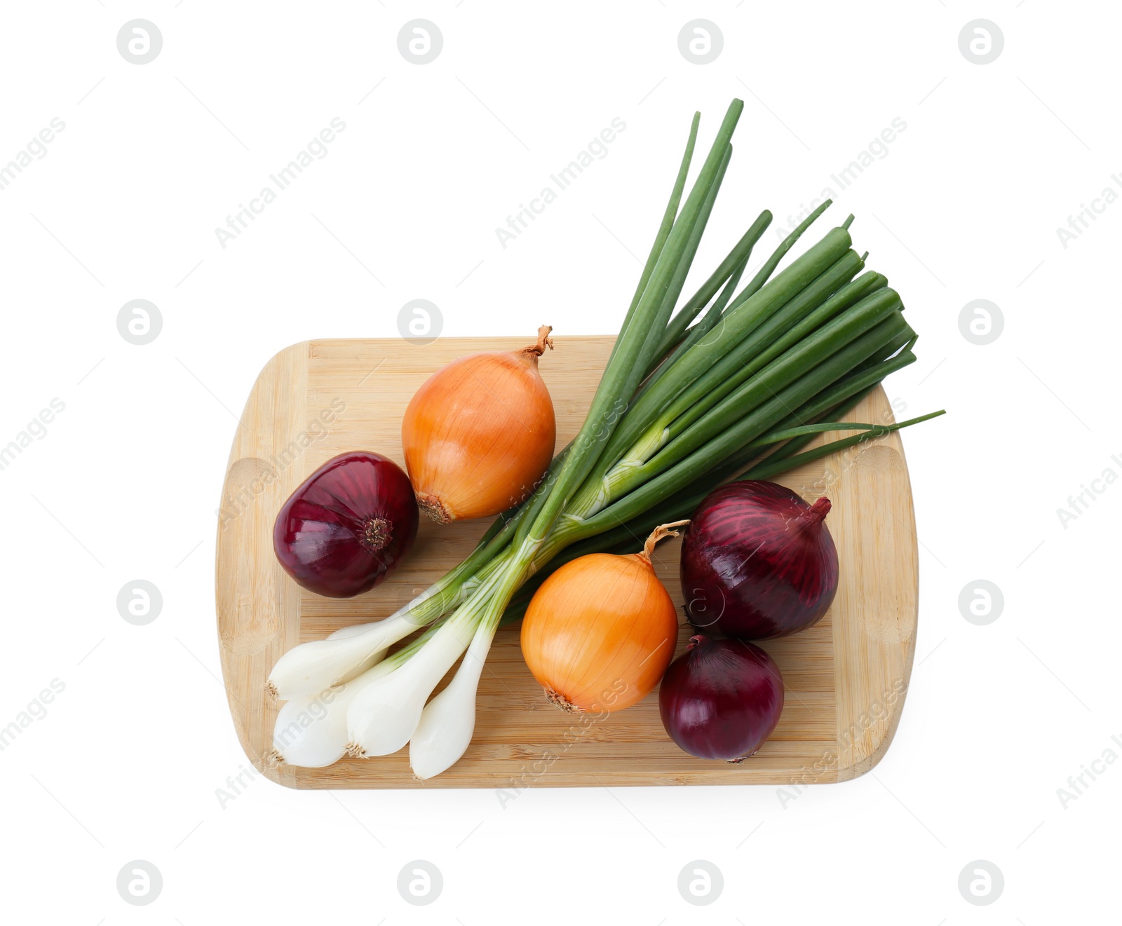 Photo of Wooden board with different kinds of onions isolated on white, top view