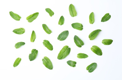 Flat lay composition with fresh green mint leaves on white background