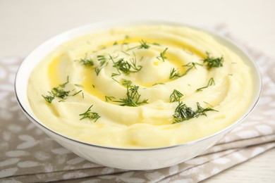 Photo of Freshly cooked homemade mashed potatoes on white table, closeup
