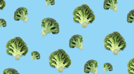 Image of Pattern of fresh green broccoli on light blue background, banner design