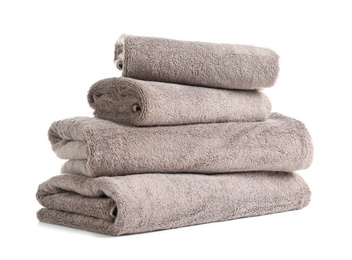 Photo of Stack of fresh towels isolated on white