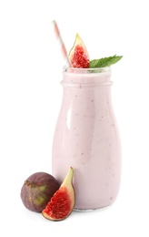 Delicious fig smoothie in glass bottle on white background