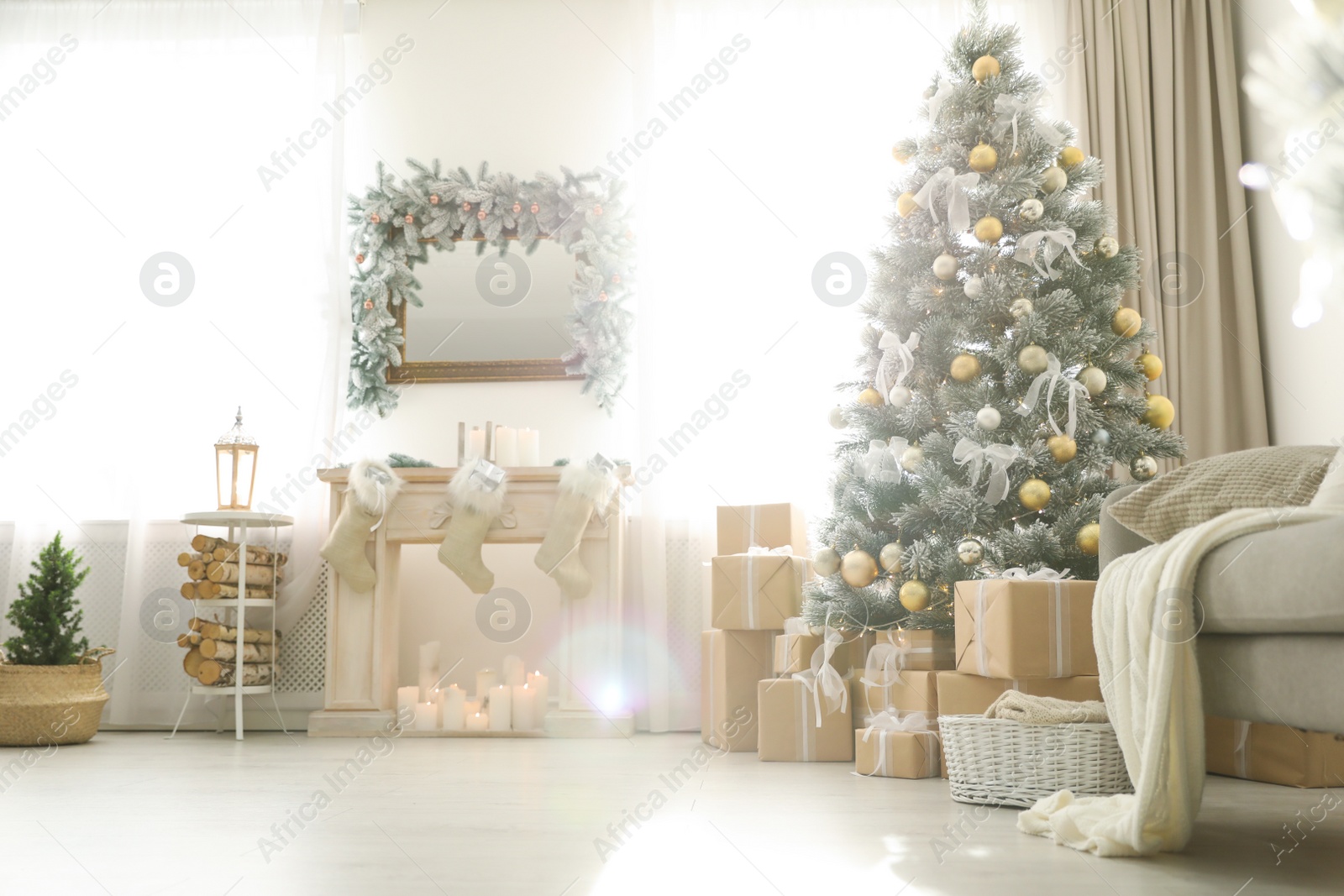 Photo of Stylish Christmas interior with beautiful decorated tree and fireplace