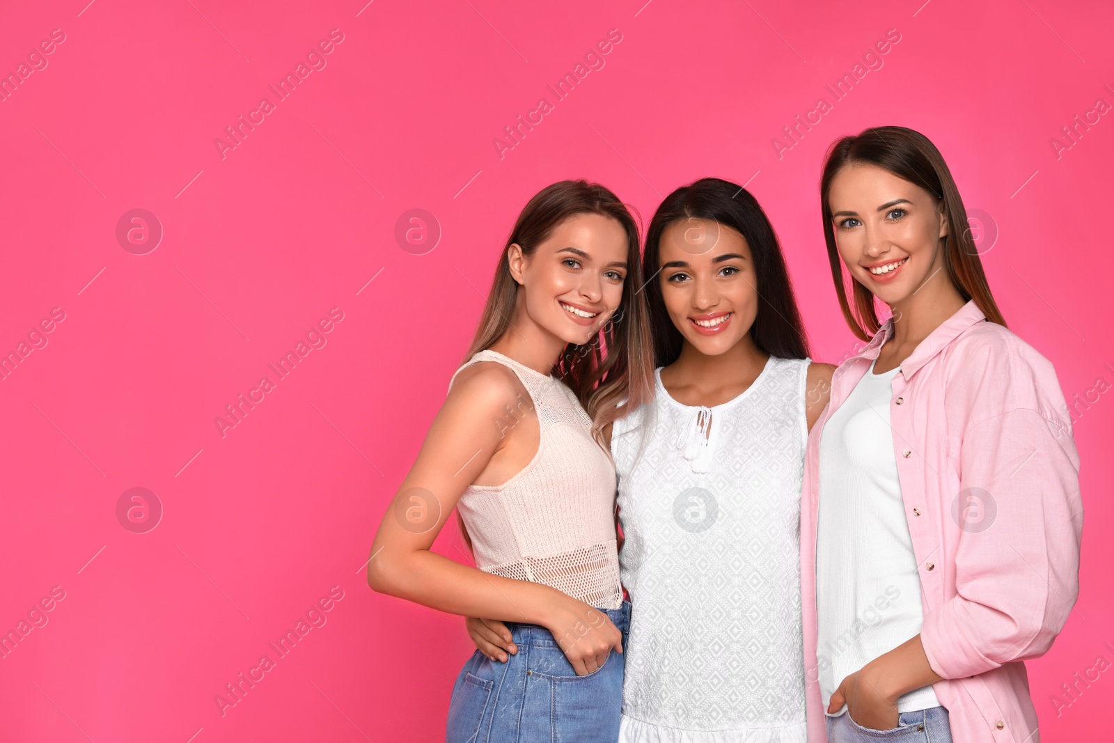 Photo of Happy women on pink background, space for text. Girl power concept