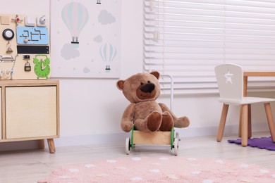 Stylish kindergarten interior with wooden furniture and different toys
