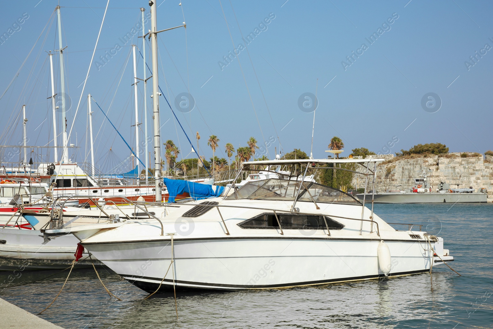 Photo of Beautiful view of sea port with different moored boats and ship on sunny day