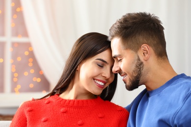 Happy young couple spending time together at home