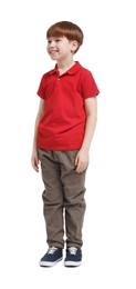 Photo of Little boy in red polo shirt and beige pants on white background