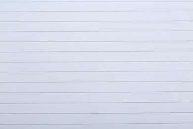 Photo of Lined notebook sheet as background, top view