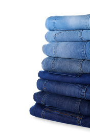 Stack of different jeans isolated on white