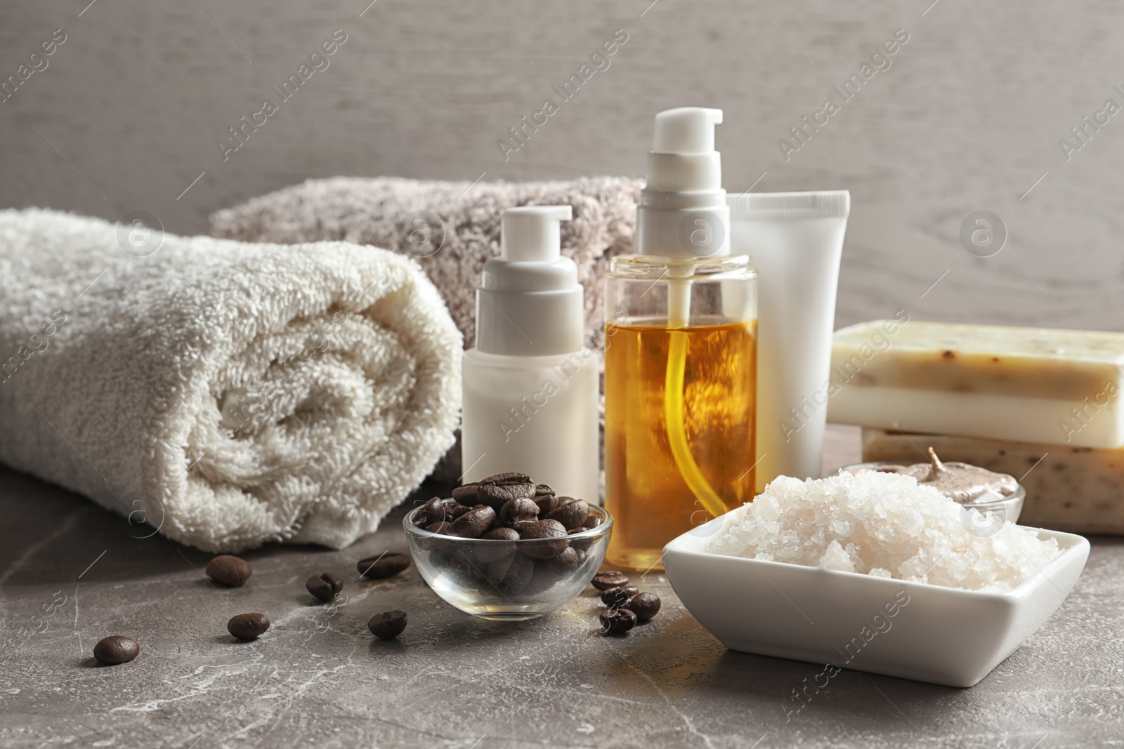 Photo of Handmade natural body scrub, ingredients and cosmetic products on table