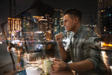 Image of Double exposure of male designer and night cityscape 