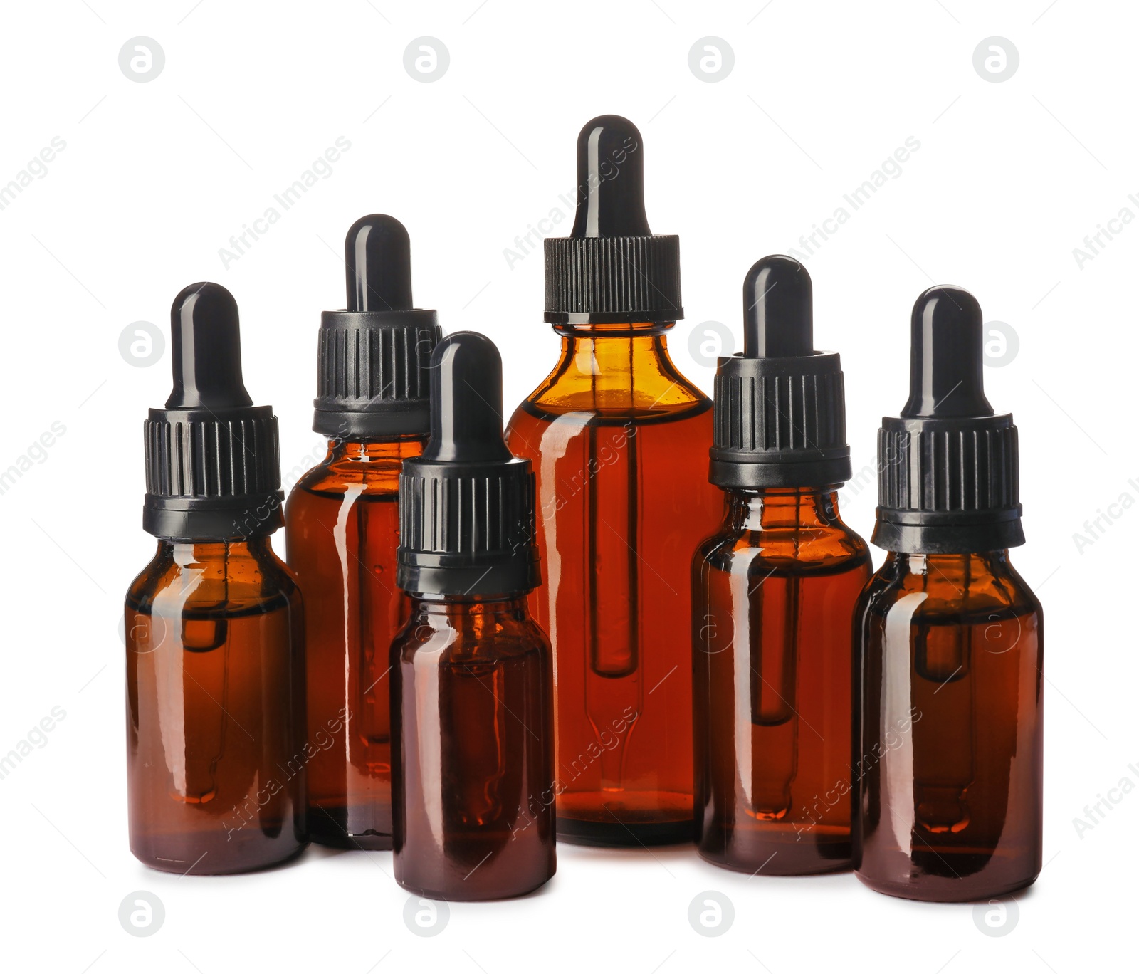 Photo of Cosmetic bottles of essential oils on white background