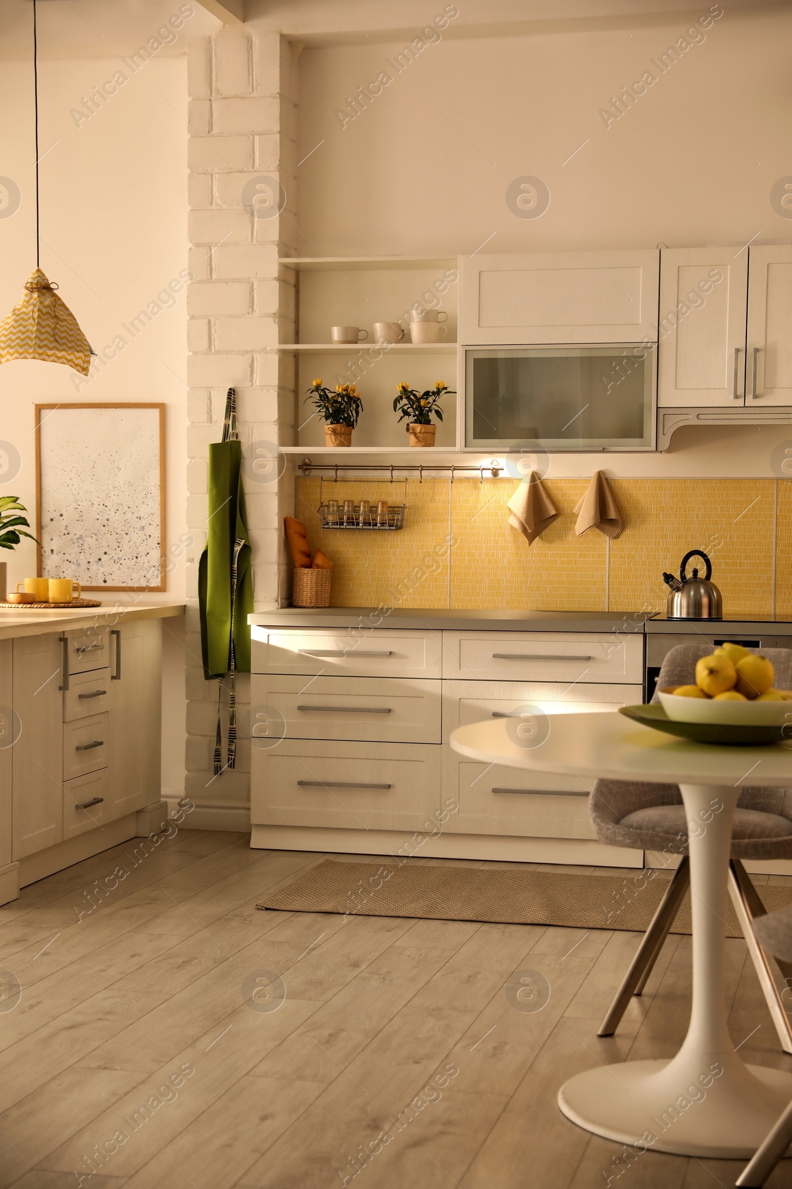 Photo of Modern kitchen interior with stylish white furniture