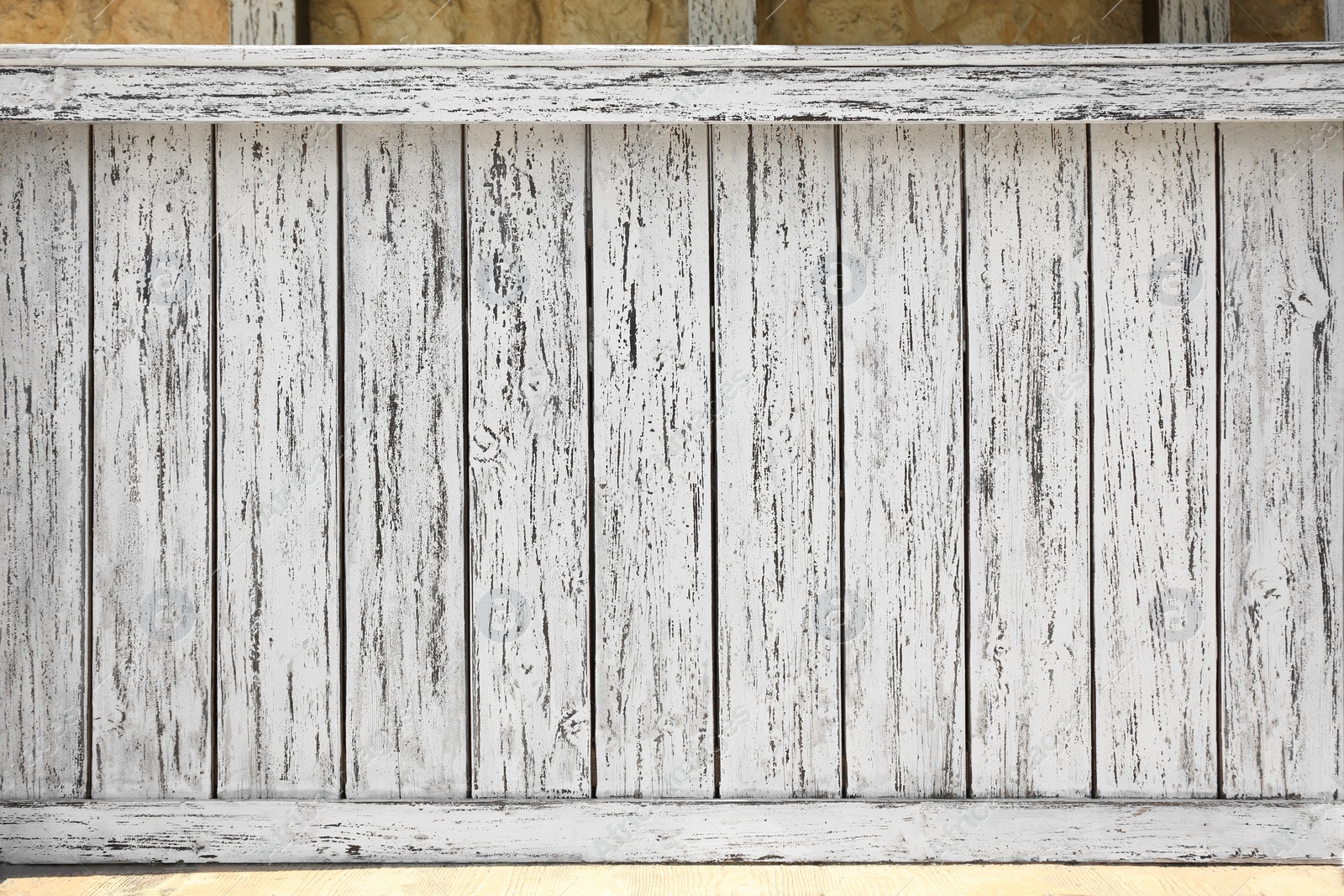 Photo of Closeup view of white wooden fence outdoors on sunny day