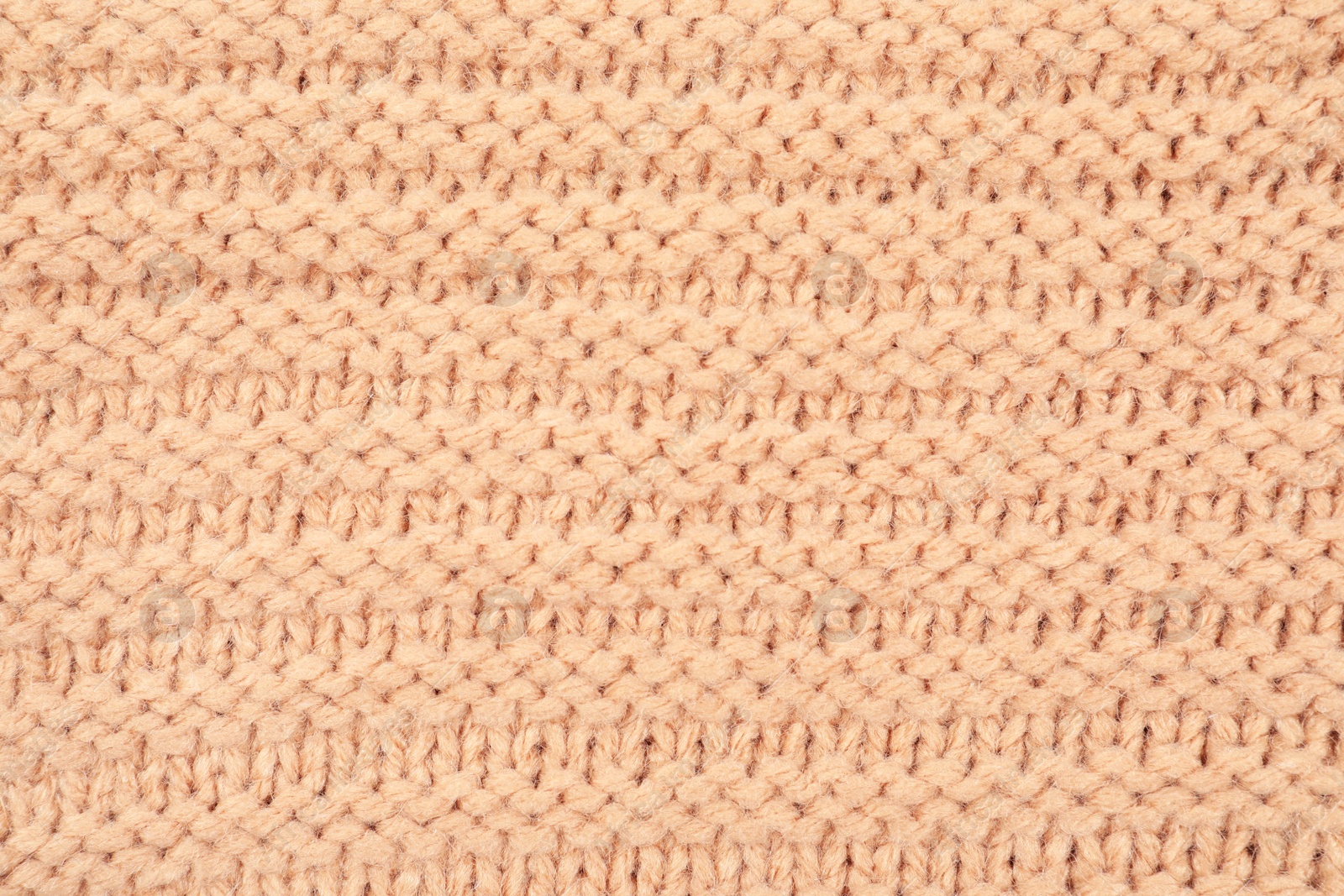 Photo of Texture of cozy warm sweater as background, closeup