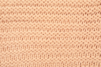 Photo of Texture of cozy warm sweater as background, closeup