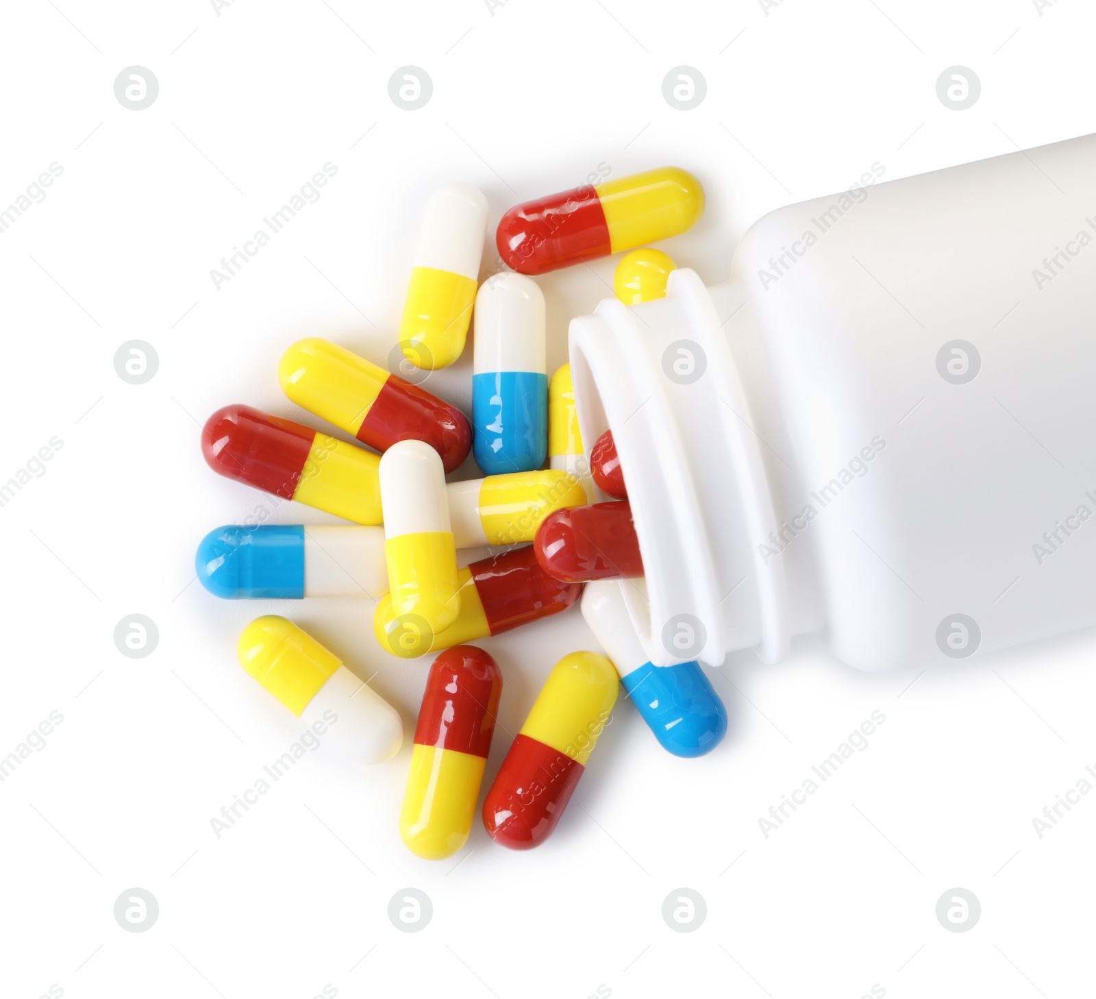 Photo of Antibiotic pills and bottle isolated on white, top view