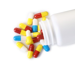 Antibiotic pills and bottle isolated on white, top view