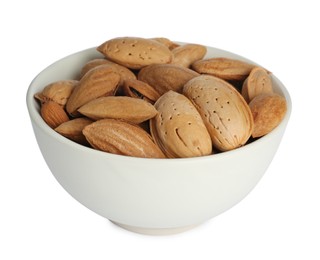 Photo of Ceramic bowl with almonds isolated on white. Cooking utensil