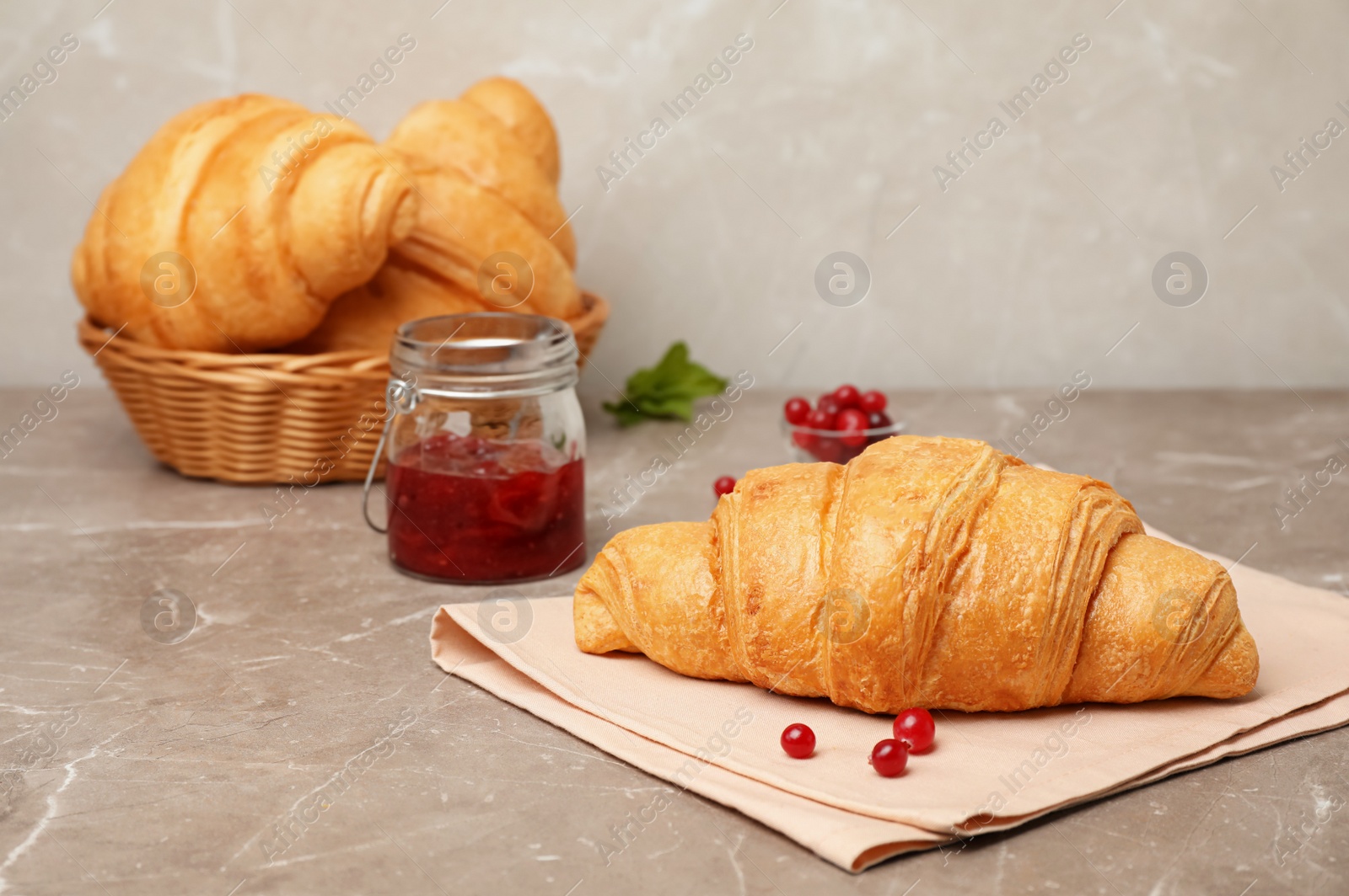 Photo of Tasty croissant served for breakfast on table