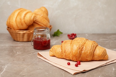 Photo of Tasty croissant served for breakfast on table