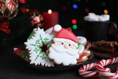 Photo of Bright delicious Christmas cookies on black table